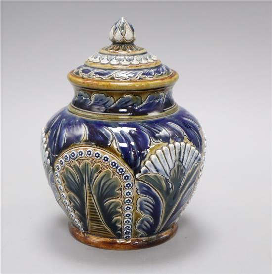 A Doulton Lambeth jar and cover, assistants mark E S, dated 1876, incised mark and number 522, decorated with Persian style flowers, h